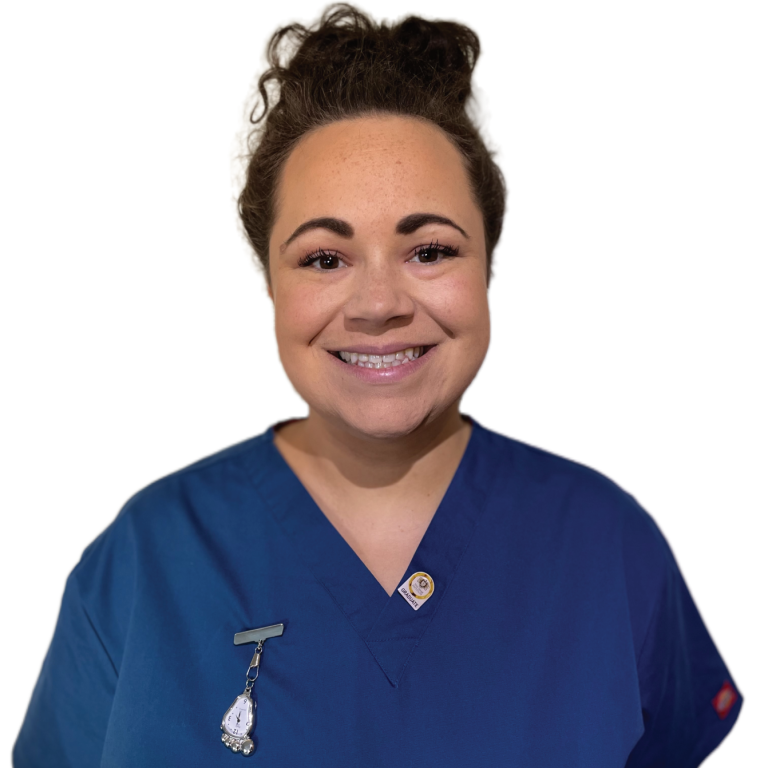 A picture of Emily, smiling in her scrub uniform